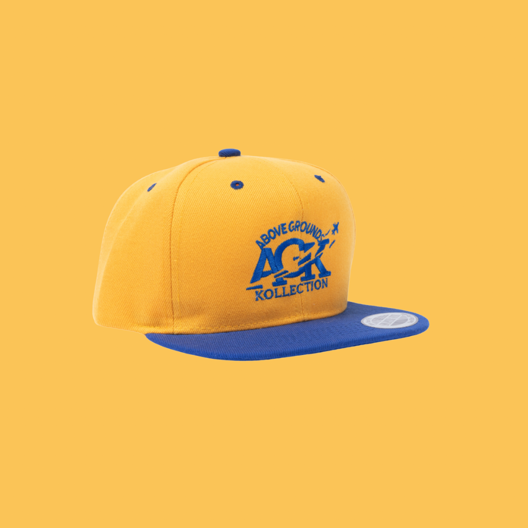 ABOVE GROUNDS KOLLECTION SNAPBACK HAT [YELLOW/BLUE]